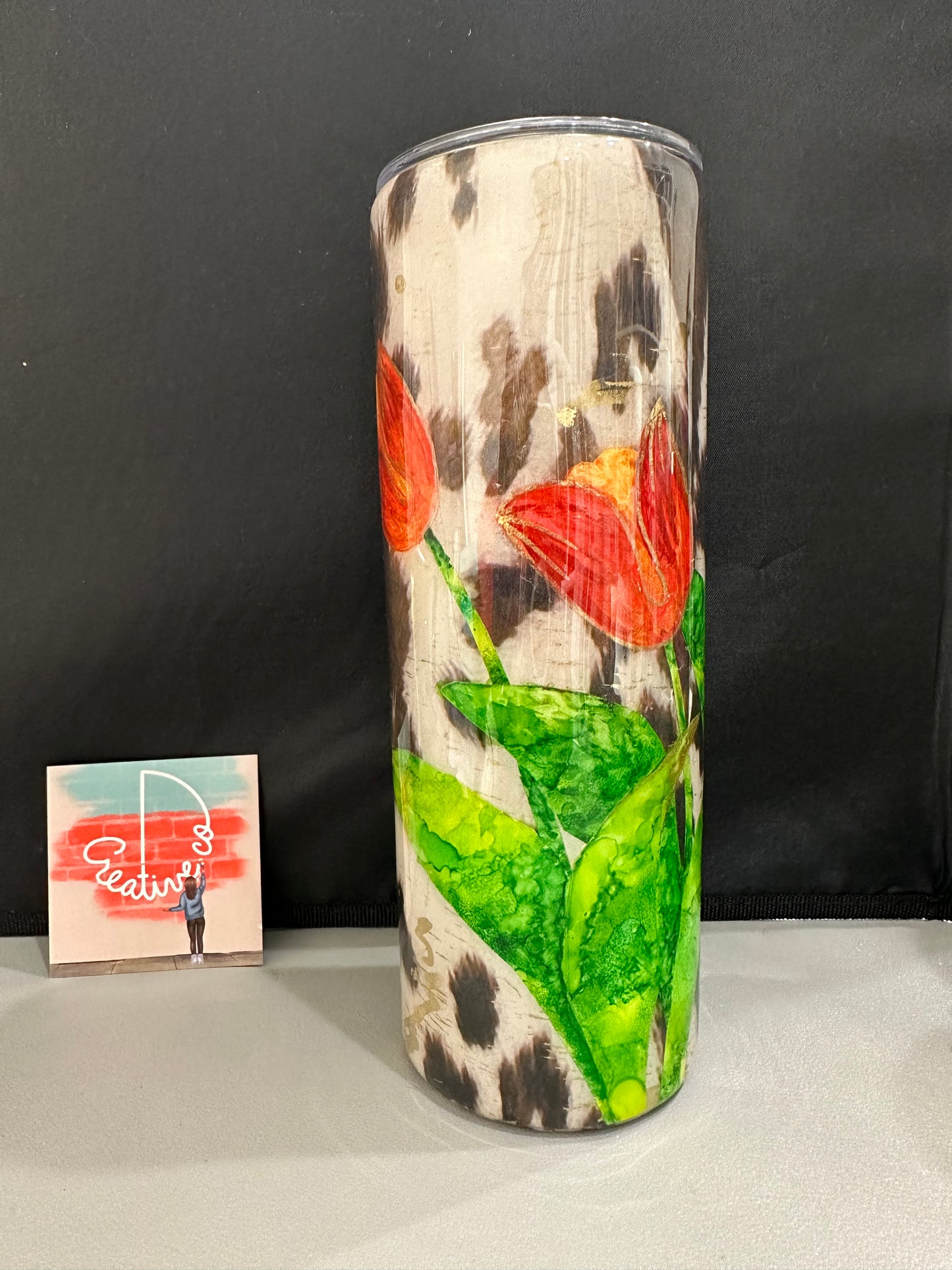 Orange  Gold Lined Hand Painted Tulips on Cow print RTS 20 oz skinny Tumbler